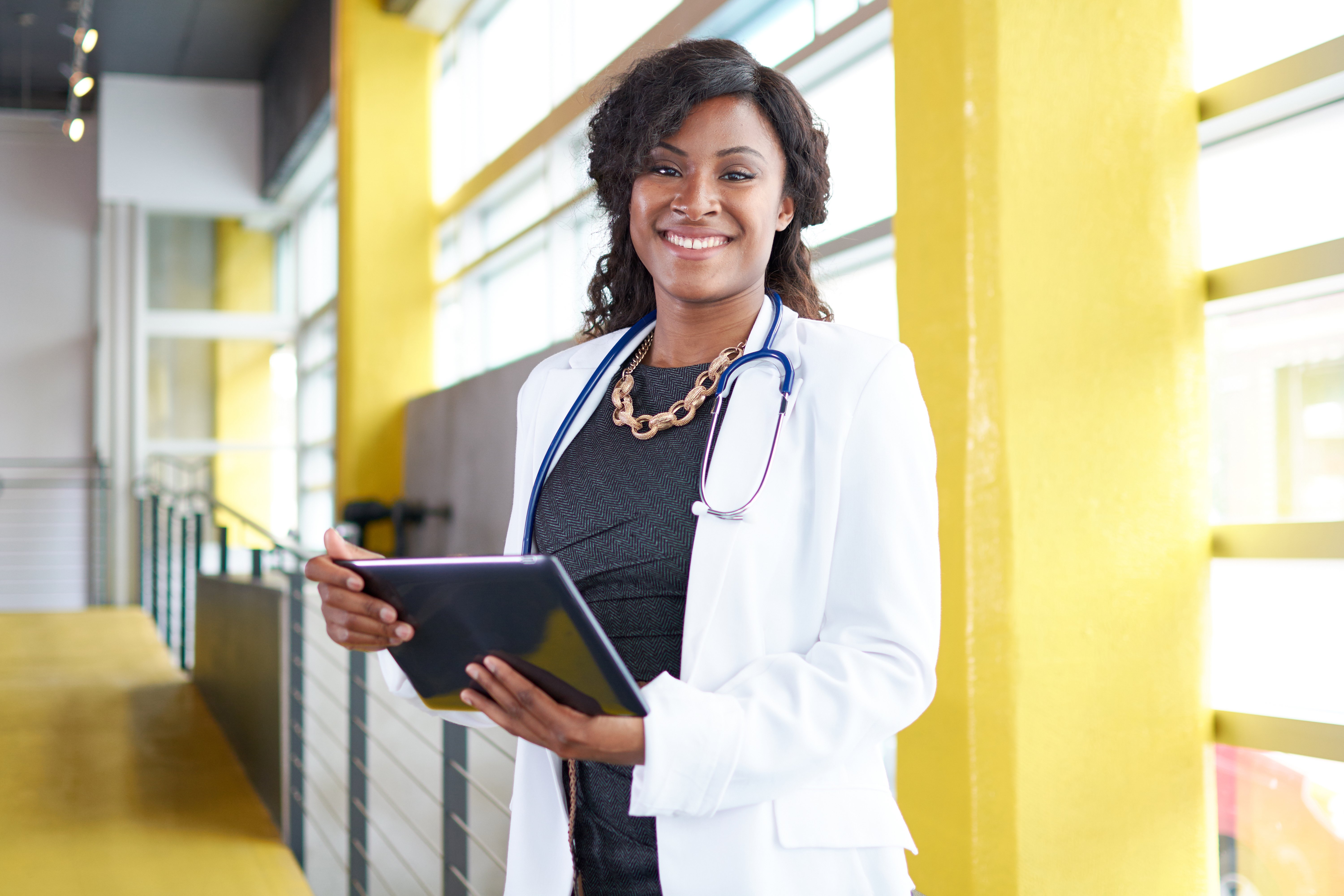 Female doctor holding a tablet. 2021 healthcare staffing trends.